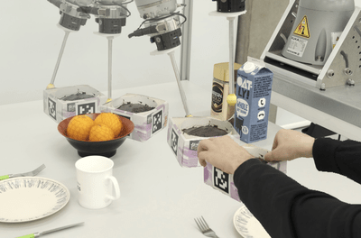 Robot pushing objects in a cluttered table setting